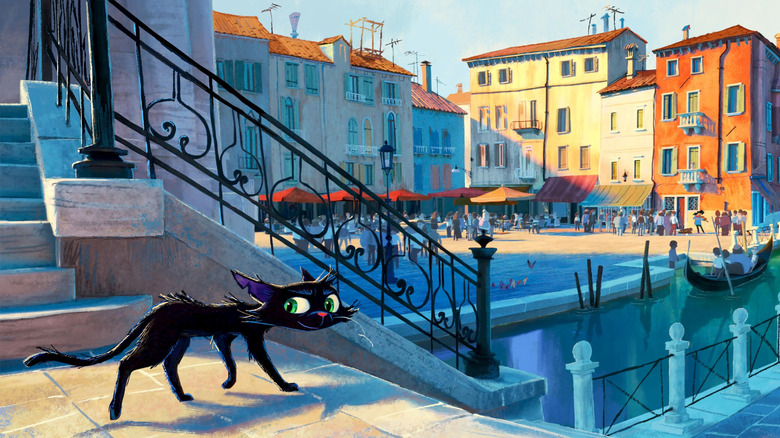 A black cat looking behind him on a Venician canal in Gatto