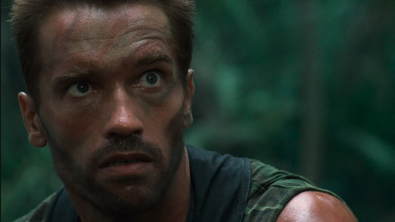 Dutch is dirty and scarred but alive after his battle with the Predator